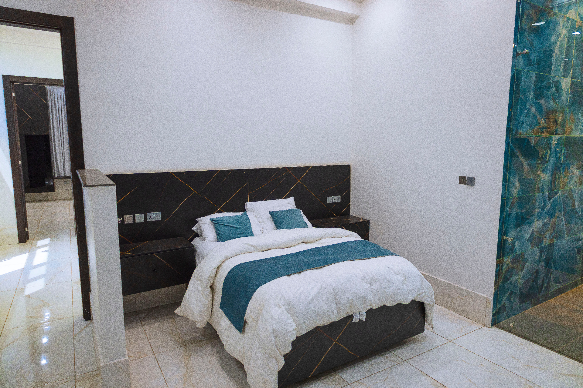 Guest bedroom with onyx marble accents