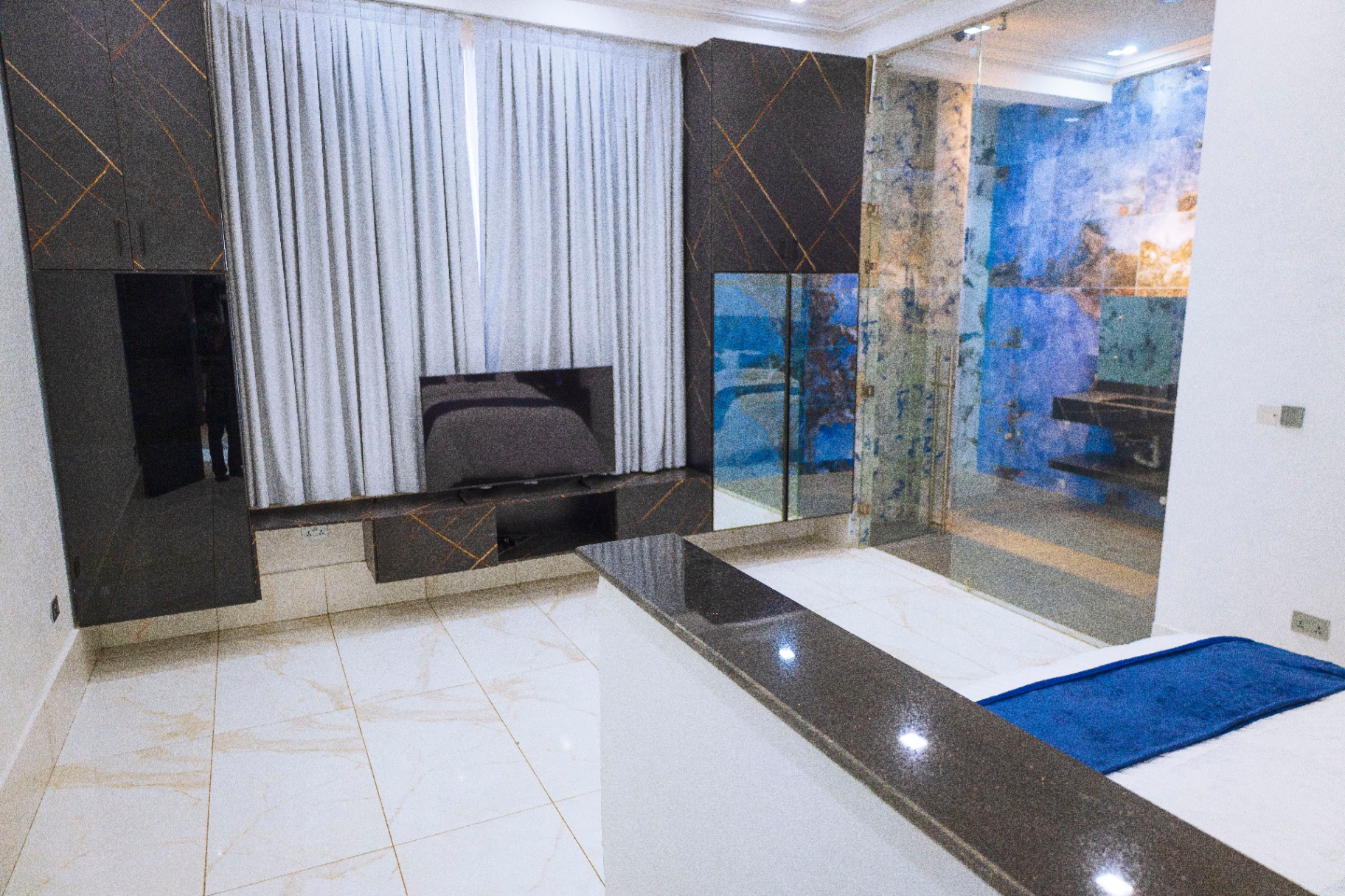 Master suite with feature wall and en-suite